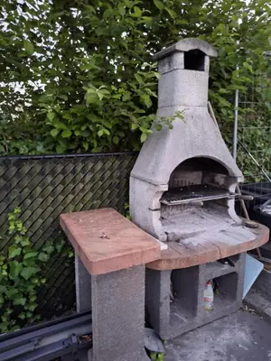 an outdoor oven with a wooden table on top at House for TOMMORLAND 700 m in Boom 2850 in Boom