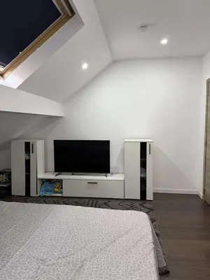 a living room with a flat screen tv on a wall at House for TOMMORLAND 700 m in Boom 2850 in Boom
