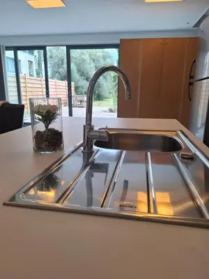 a sink in a kitchen with a window at Secret garden