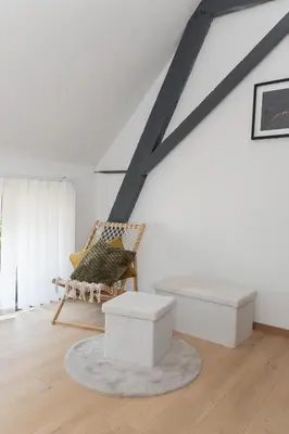 a living room with a chair and a bench at Secret garden