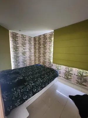 a bedroom with a bed and a cat in it at Gezellig verblijf met balkon in Brussels