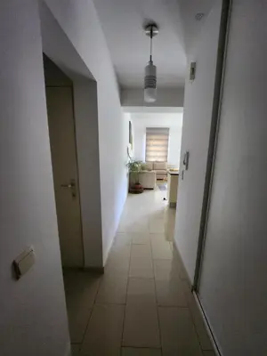 an empty hallway with a door and a room at Gezellig verblijf met balkon in Brussels