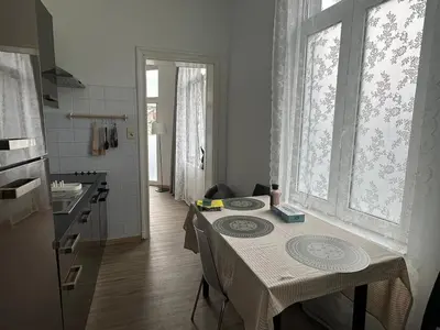 a kitchen with a table with two plates on it at Midi Retreat in Brussels