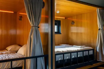 a room with two bunk beds and a window at Cyberdeck for big groups in Ghent