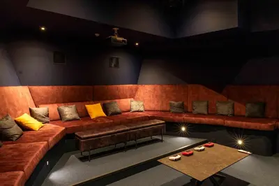 a living room with a couch and a table at Cyberdeck for big groups in Ghent