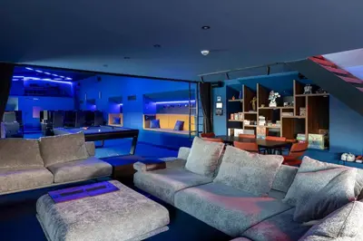 a living room with couches and a dining room at Cyberdeck for big groups in Ghent