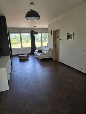a living room with a couch and a table at Tomorrowland Crib in de buurt van Boom in Schelle