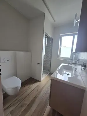 a white bathroom with a toilet and a sink at Tomorrowland Crib in de buurt van Boom in Schelle