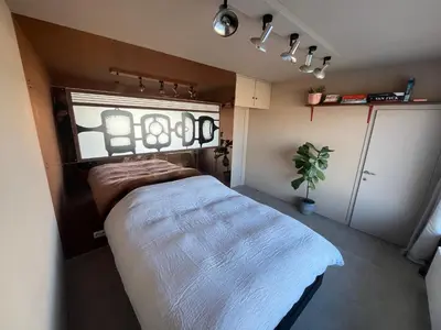 a bedroom with a bed and a window in it at Apartments overlooking Brussels in Brussels