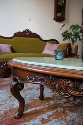 a coffee table in a living room with a couch at 18de-eeuwse woning in het hartje van Gent in Ghent