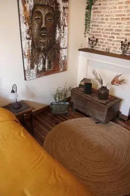 a room with a bed and a painting on the wall at 18de-eeuwse woning in het hartje van Gent in Ghent