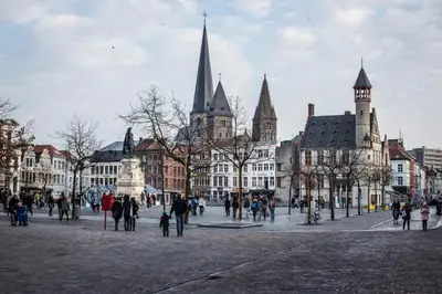 a group of people walking around a city with buildings at 18de-eeuwse woning in het hartje van Gent in Ghent