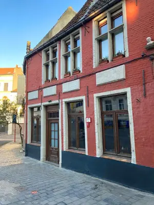 a red brick building on a city street at 18de-eeuwse woning in het hartje van Gent in Ghent