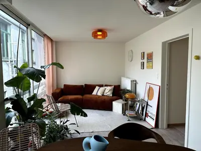 a living room with a couch and a table at Studio downtown Gent in Ghent