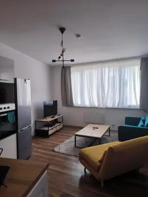 a living room with a couch and a table at Design Studio Brussels Madou in Brussels