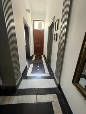 a hallway with a door in a building at Dock Suites in Ghent