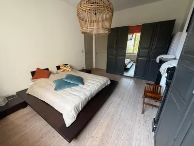 a bedroom with a large bed in a room at Dock Suites in Ghent