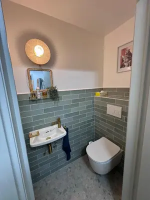 a bathroom with a toilet and a sink at Sunflora Apartment in Brussels