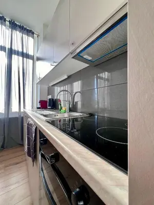 a kitchen with a sink and a counter top at Bruxnord BnB in Brussels