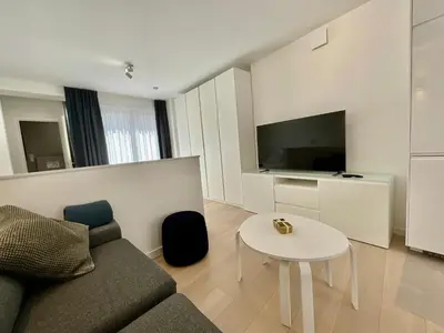 a living room with a couch and a table at Chapeliers 34 in Brussels