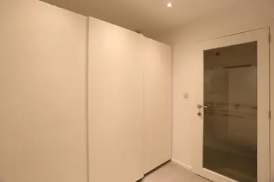 a white room with a shower and a glass door at Belliard flat in Brussels