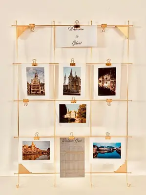 a display case filled with photos of cities at Dock Loft in Ghent