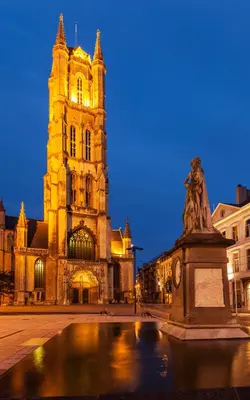 a large building with a statue in front of it at Dock Loft in Ghent