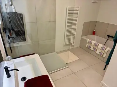 a bathroom with a sink and a bath tub at DoK9 in Ghent