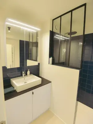 a bathroom with a sink and a mirror at Top floor apartment at Saint Peters Station in Ghent