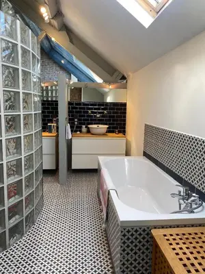 a large bathroom with a tub and a sink at The Urban Loft in Brussels West in Brussels