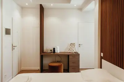 a bedroom with a desk and a bed and a table at Il Ponte Private Room with Hotel-Style Comfort in Ghent
