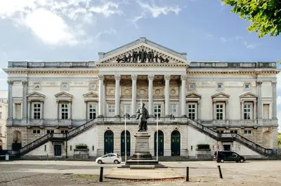 a large white building with a statue in front of it at Il Ponte Private Room with Hotel-Style Comfort in Ghent