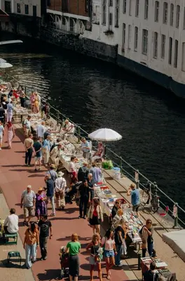 a group of people standing on a dock near the water at Il Ponte Private Room with Hotel-Style Comfort in Ghent