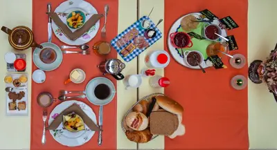 a table topped with plates of breakfast foods and drinks at B&B Tspijker in Mol