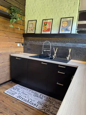 a kitchen with a sink and a counter top at Loft Cosy avec billard et à 10 minutes de l'aéroport de Zaventem in Machelen