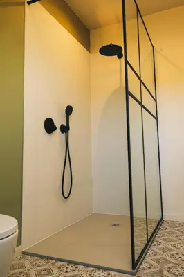 a shower stall in a bathroom with a toilet at B&B 't Kruidenhof in Assenede