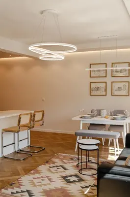a living room with a table and chairs at Bellavista Luxe Apartment with Leie View in Ghent
