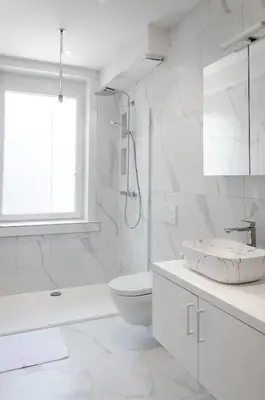 a white bathroom with a sink and a toilet at Bellavista Luxe Apartment with Leie View in Ghent