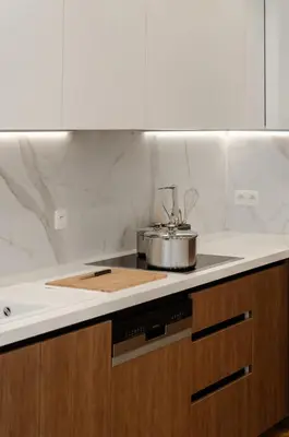a kitchen with a counter top with a pot on it at La Veduta - Luxe Apartment with Leie View in Ghent