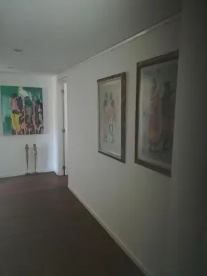 a room with three paintings on a wall at Bvba Bacana in Rotselaar