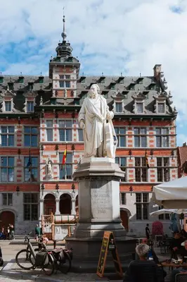 a statue of a man in front of a building at La Petite Foret Contemporary Apartment in Halle in Halle