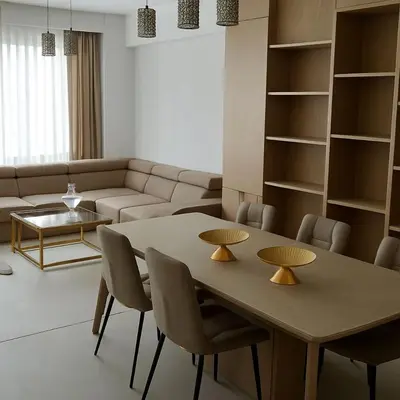a living room with a table and a couch at Belgielei business apartment in Antwerp