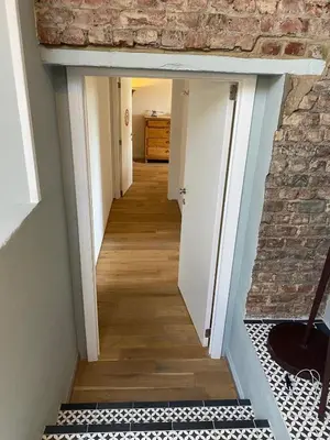 a hallway of a house with a brick wall at Urban Loft in Brussels West in Brussels