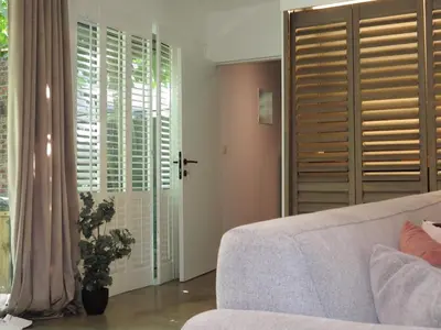 a living room with a couch and a window at Casa Milo in Lokeren