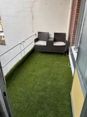 a hallway with two chairs and green grass at Dream home for tomorrow land in Boom