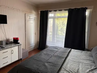 a bedroom with a bed and a large window at Dream home for tomorrow land in Boom