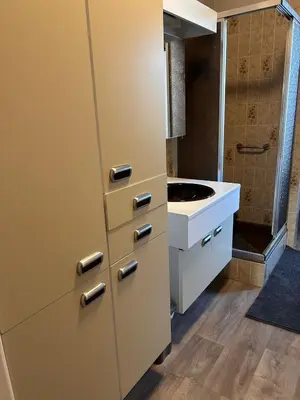 a small kitchen with a sink and a cabinet at Dream home for tomorrow land in Boom