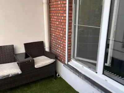 a balcony with two chairs and a window at Dream home for tomorrow land in Boom