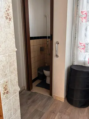 a bathroom with a toilet and a shower at Dream home for tomorrow land in Boom