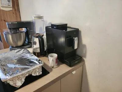 a coffee maker sitting on top of a counter at Tomorrowland rooms in Rumst
